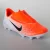 CHUTEIRA NIKE VAPOR 12 CLUB PS V FG INFANTIL LARANJA/BRANCO