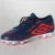 CHUTEIRA UMBRO CAMPO VELOX MARINHO/LARANJA