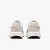 TÊNIS NIKE RUN DEFY FEMININO BEGE/BRANCO